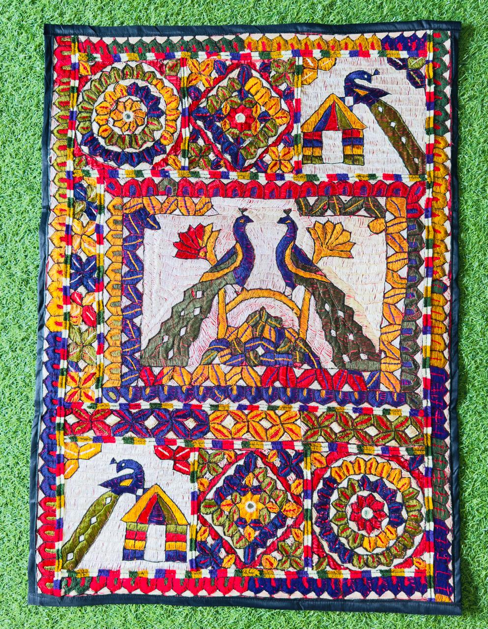 Hand-embroidered Thari wall hanging with peacock motif